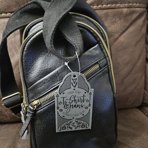 Black Leather-look Crossbody Backpack with Gold Accents